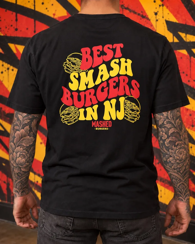 Back of the black Original tee: “Best Smash Burgers in NJ” in red and yellow with drawn burgers.